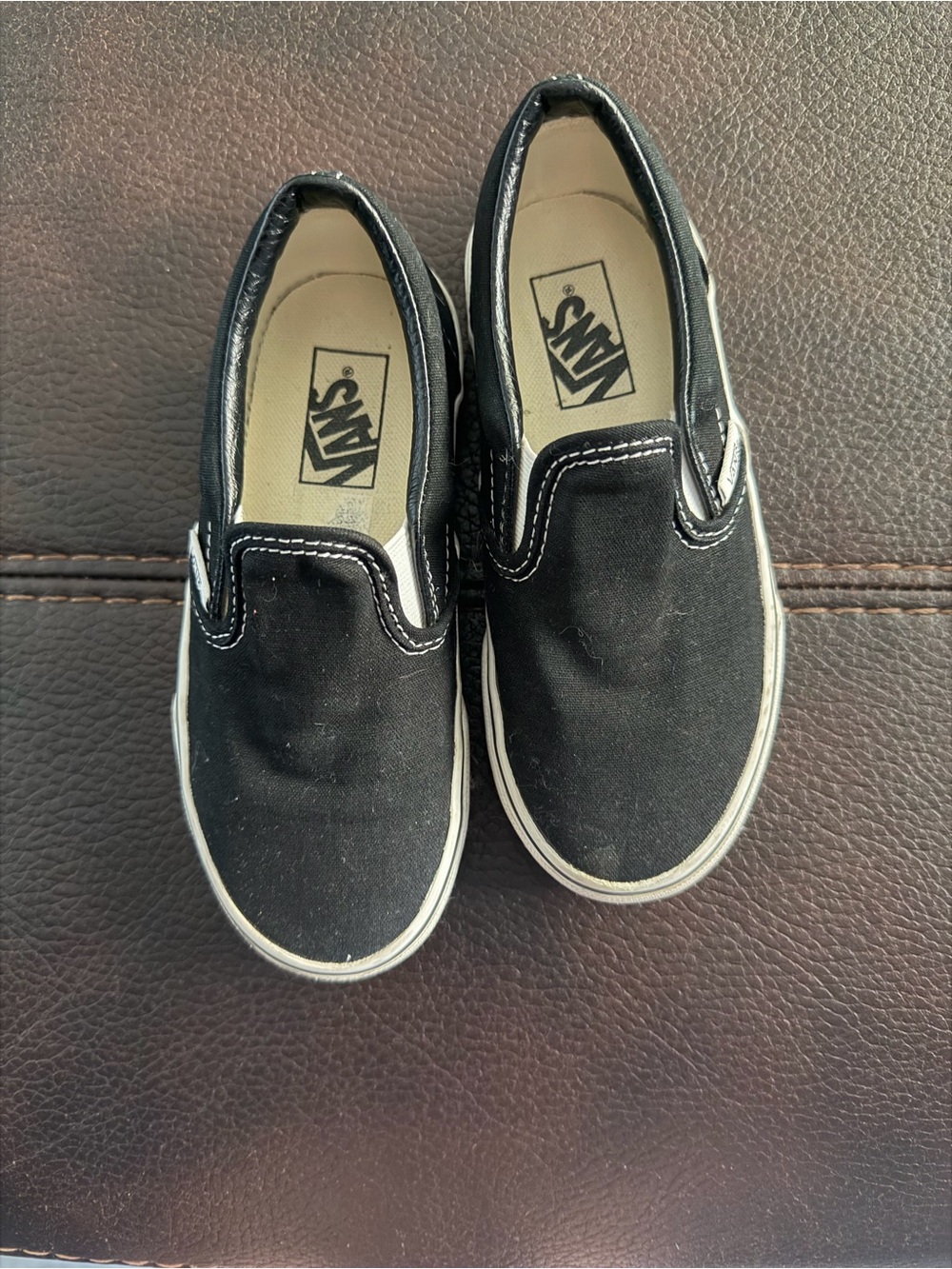Vans Kids Slip-On Sneakers in Black and White